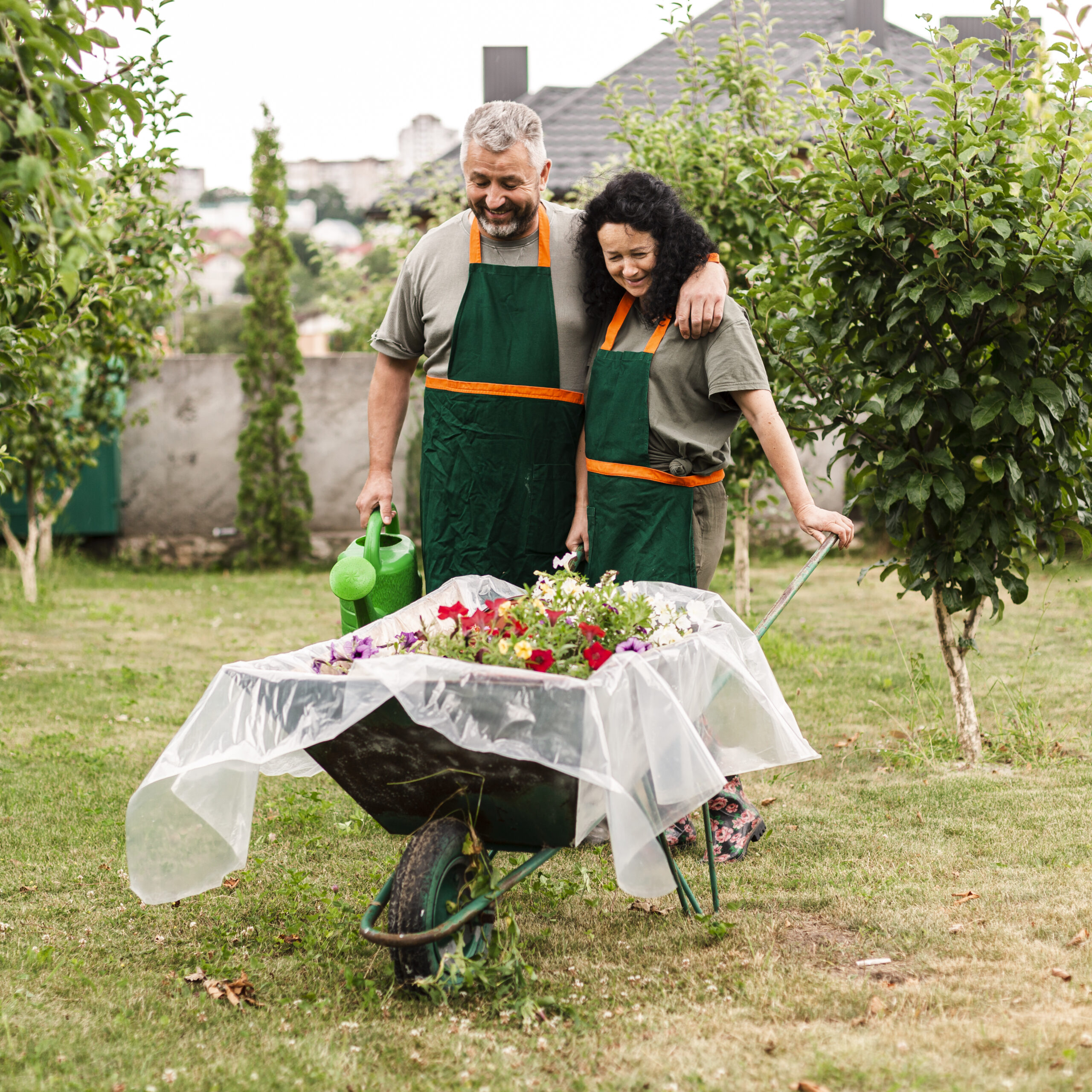 front-view-happy-couple-with-wheelbarrow