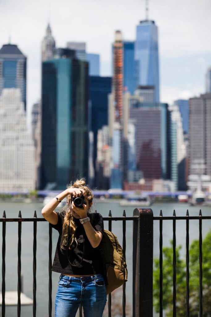 Manish-Patel-westchester-young-woman-with-blurred-city-background_23-2148232342