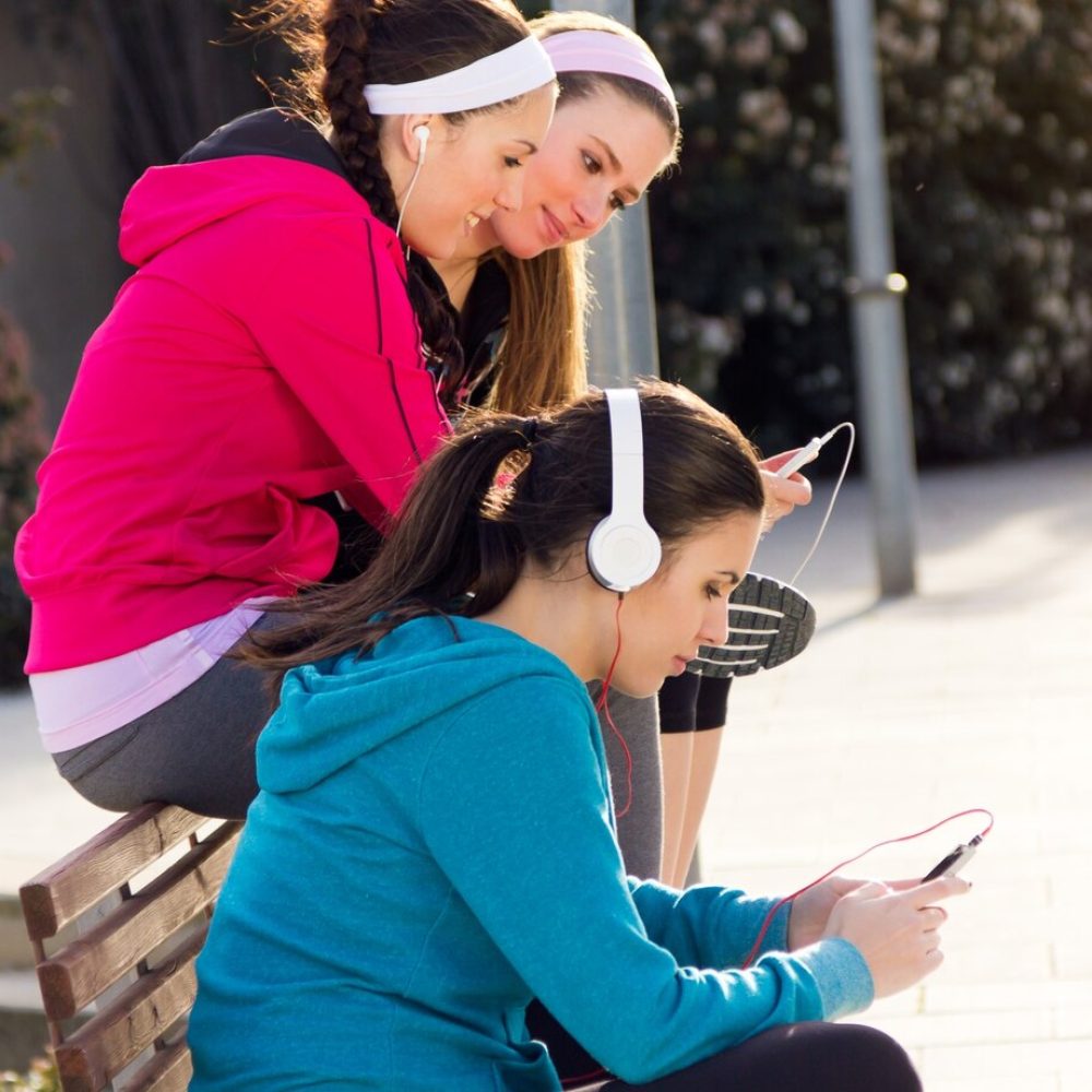 Manish-Patel-westchester-friends-having-fun-with-smartphones-after-exercise_1301-7065